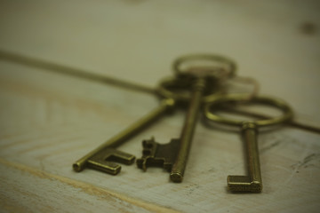 Old keys on a rustic background