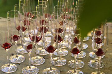 Champagne glasses outside, on a table