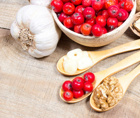 Fresh fruit of hawthorn, garlic and walnuts. The concept of alternative medicine.