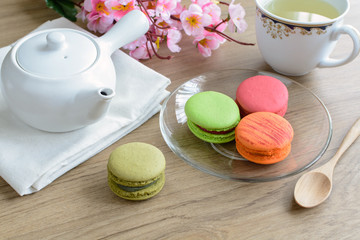 Cup of tea with colorful macaroons