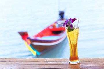 Ice tea. Tropical cocktail on long tail background Thailand Samui