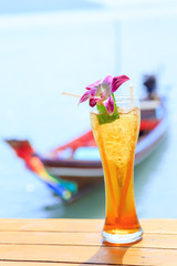 Ice tea. Tropical cocktail on long tail background Thailand Samui