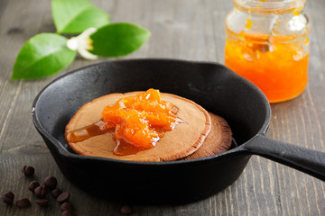 Chocolate pancakes with orange marmalade.