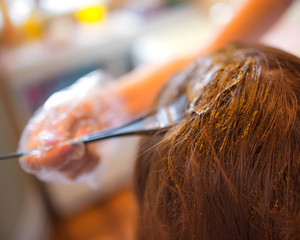 Beauty routine of coloring hair with natural henna.
