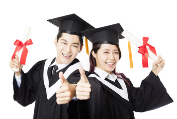 Graduation man and woman education students with thumb up