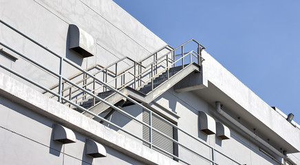 Steel staircase with plaster wall