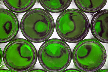 Beer bottles of green glass background, glass texture