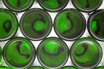 Beer bottles of green glass background, glass texture
