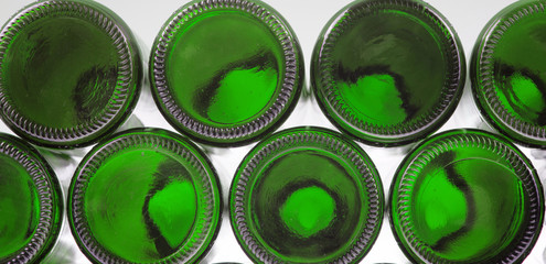 Beer bottles of green glass background, glass texture