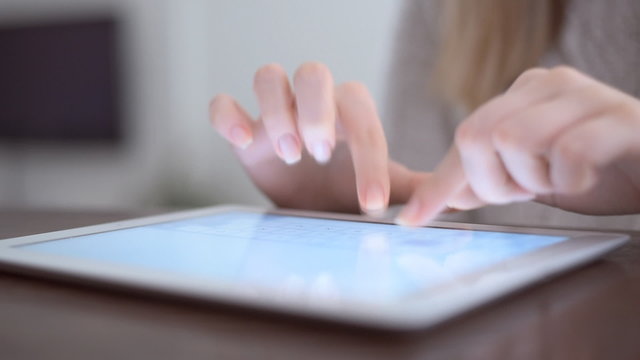 Hand touching screen on modern digital tablet pc.