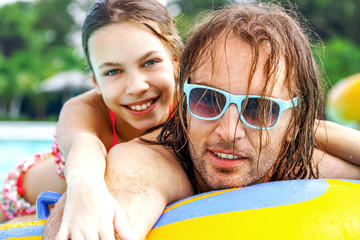 Father with daughter in water park