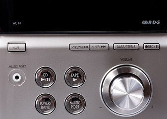 Hand on Sound volume control knob