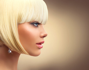 Beautiful fashion blonde woman with bob haircut. Fringe hairstyle