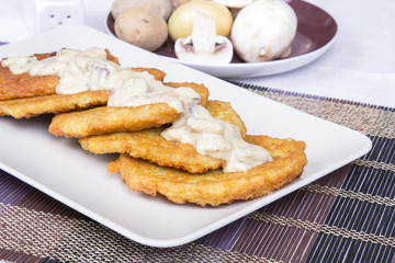 potato pancakes with mushroom sauce
