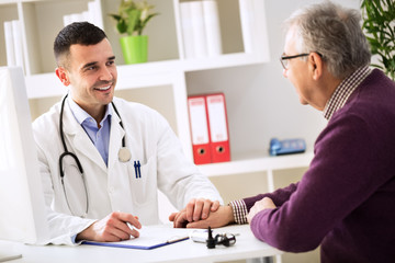 Young doctor holding hand and console his patient