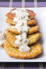 potato pancakes with mushroom sauce
