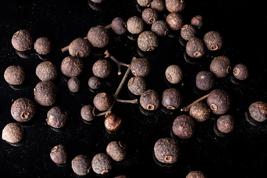 Allspice English Pepper Berries Scattered On Black Background From Above 