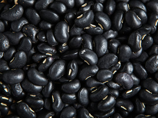 close up pile of black beans as a background