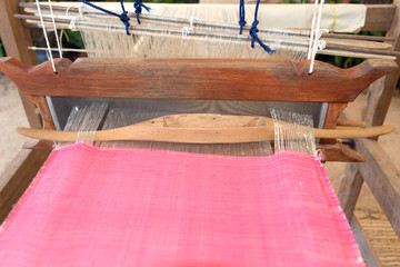 Close up Loom weaving silk pink  in thailand