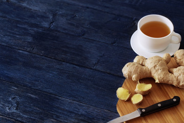 Cup of Ginger tea on dark blue background