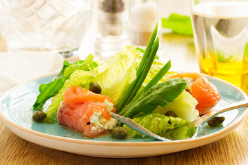 Salad rolls with salmon and cottage cheese.