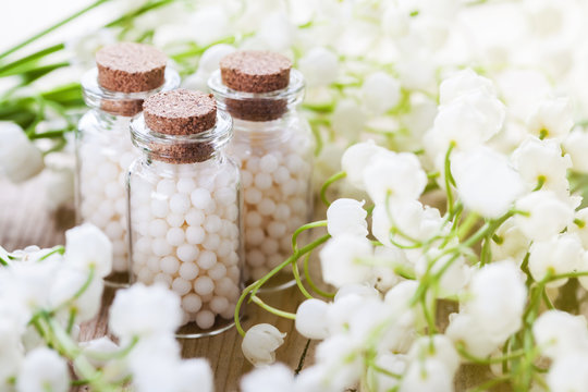 homeopathic pills on color background