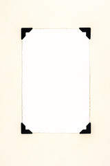 Blank old photo for your picture, with photo corners on aged paper.