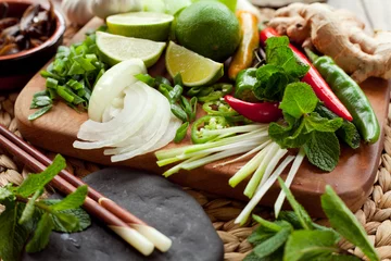 Foto auf Acrylglas Kochen asian food cooking board ingredients lime chili 