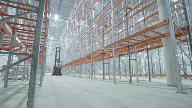 loader goes in the modern and bright warehouse