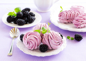 Homemade marshmallows with fresh berries.