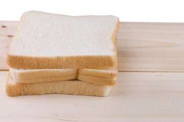 Whole wheat bread on wooden table.