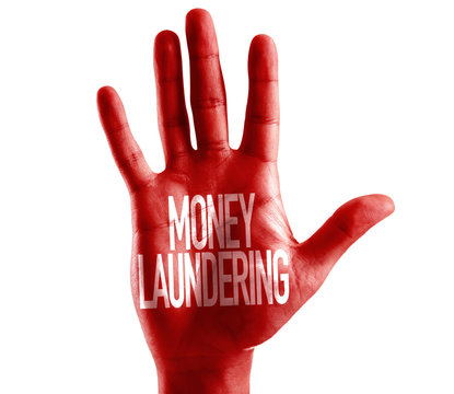 Money Laundering written on hand isolated on white background