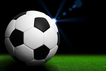 Fototapeta na wymiar Soccer ball on green stadium