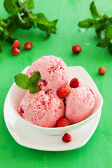 Homemade ice cream with wild strawberry.