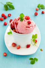 Homemade ice cream with wild strawberry.