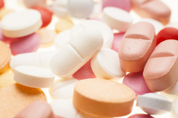 Macro photograph of various colorful medicinal pills