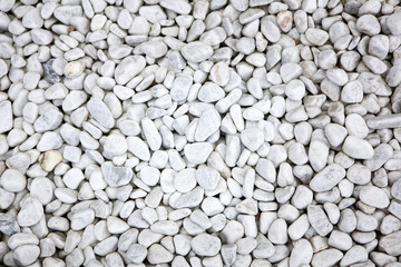 White stones at a grave as a background