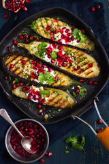 grilled eggplants with garlic yogurt sauce, walnuts and pomegran