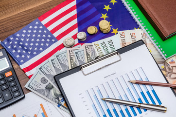 Dollar, Euro currency and flag with coin, notepad on table