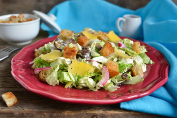Chinese cabbage salad with croutons, cheese and delicate sauce