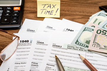 Naklejka premium Time for taxes with money