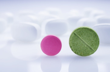 Medicine pink and green pill. Close-up