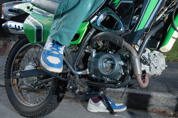 Teenage Boy Bout To Kick Start A Motorbike