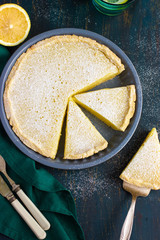 lemon  tart on dark blue background