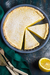lemon  tart on dark blue background