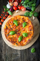 homemade pizza margherita with mozzarella, basil and tomatoes
