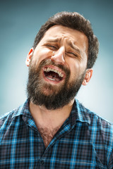 Fototapeta premium The crying man with tears on face closeup