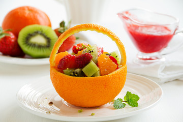 Fruity summer salad in orange.