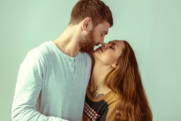 Studio shot of beautiful young couple 