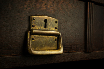 Old lock in a wooden drawer